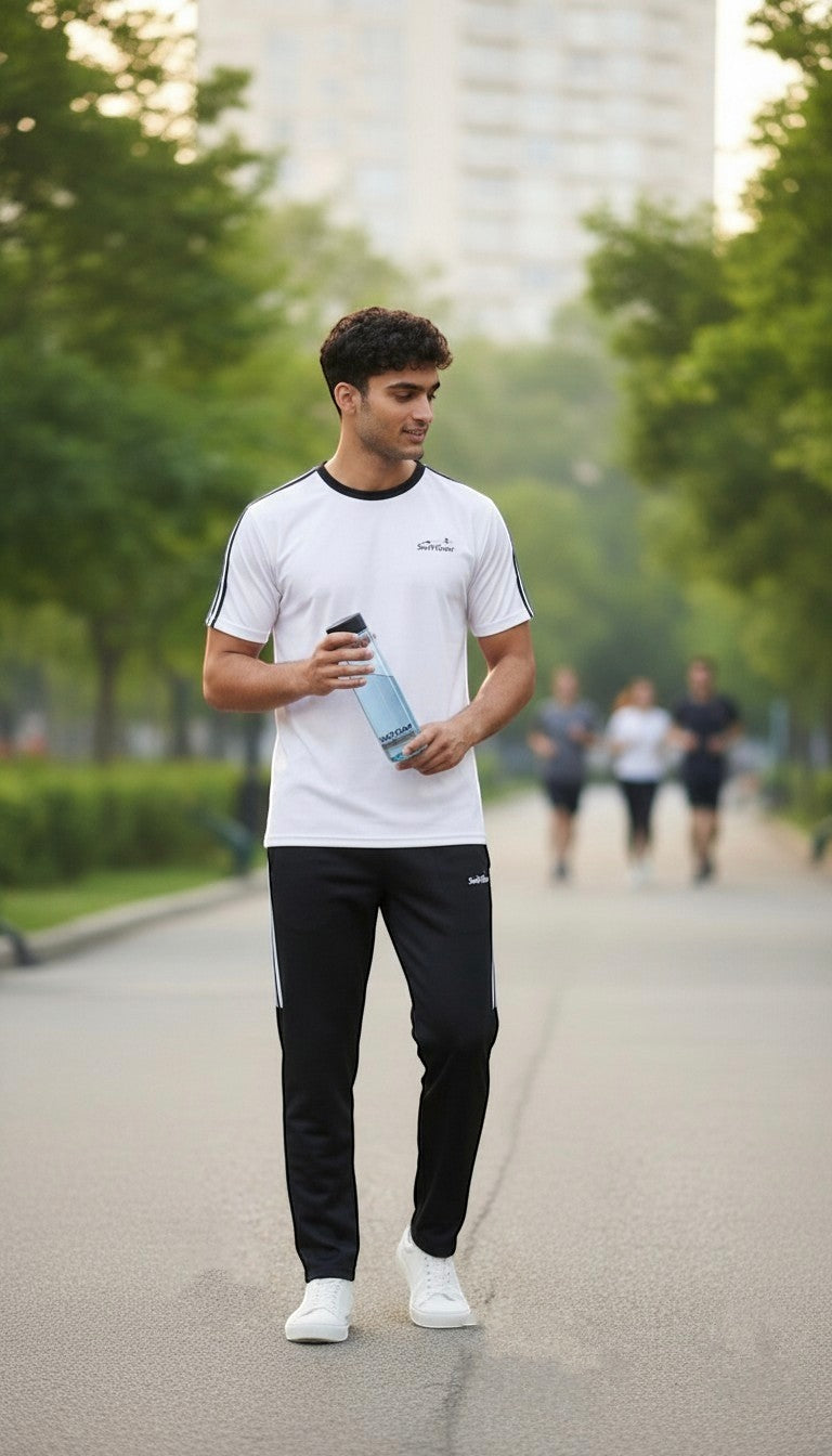 Swift Gear white short-sleeved t-shirt with black piping and black athletic pants with white stripes.
