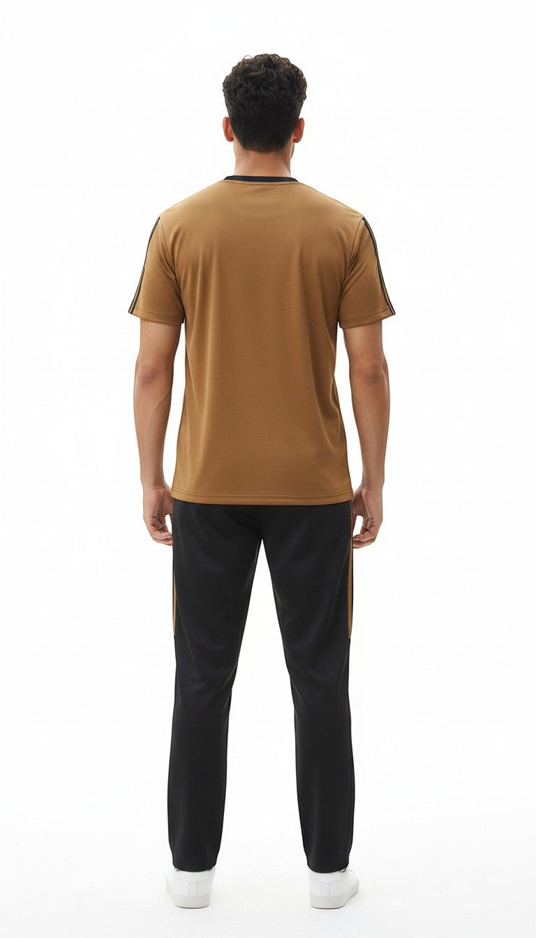 Swift Gear brown short-sleeve t-shirt with black and gold trim and black track pants with gold stripes.